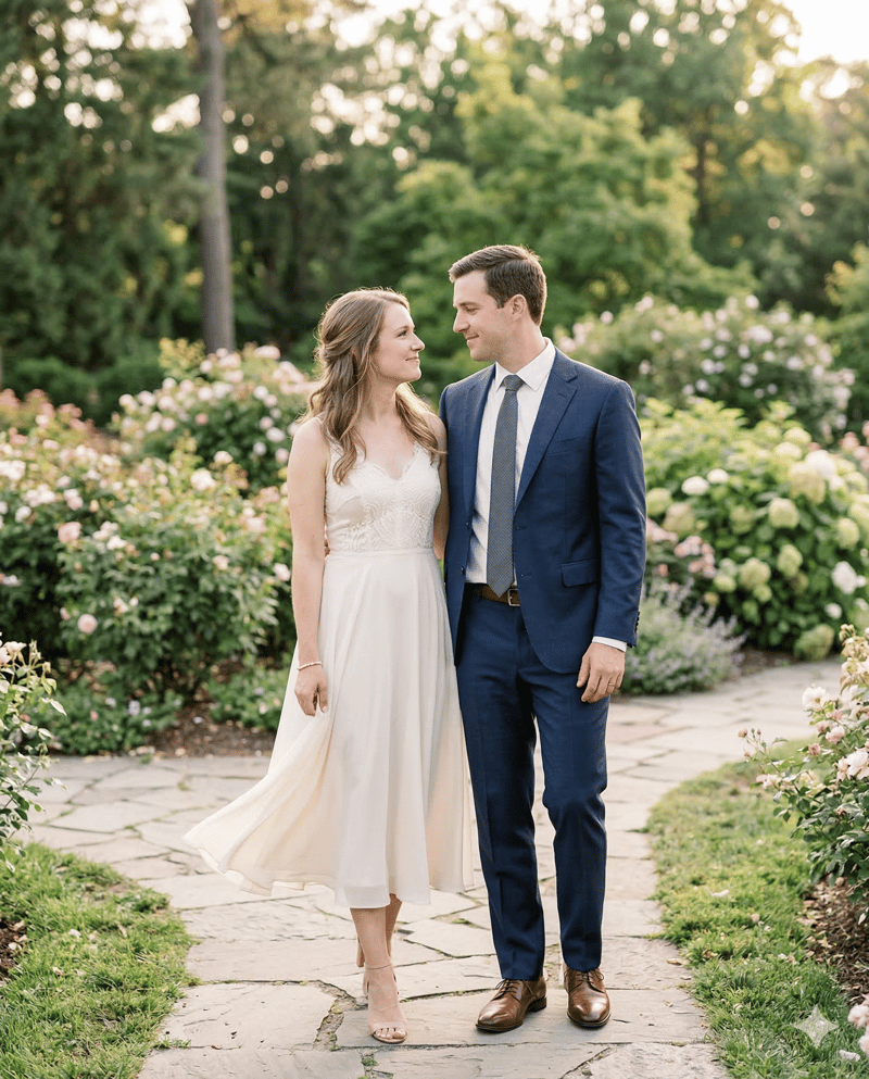 Couple in classic elegant engagement photo outfits - midi dress and suit